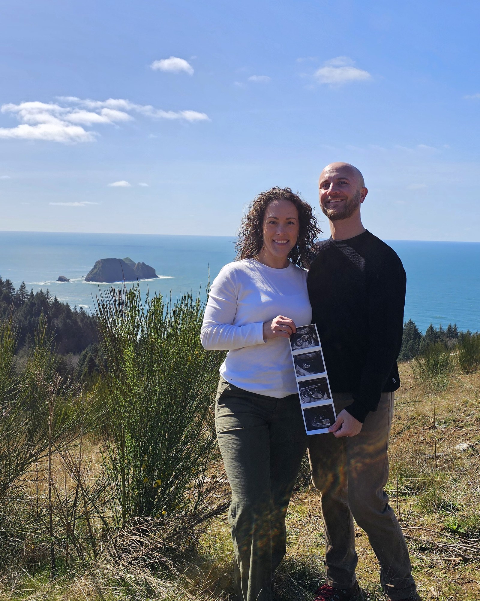 The Hayes family on the Oregon coast, holding the first ultrasound photographs